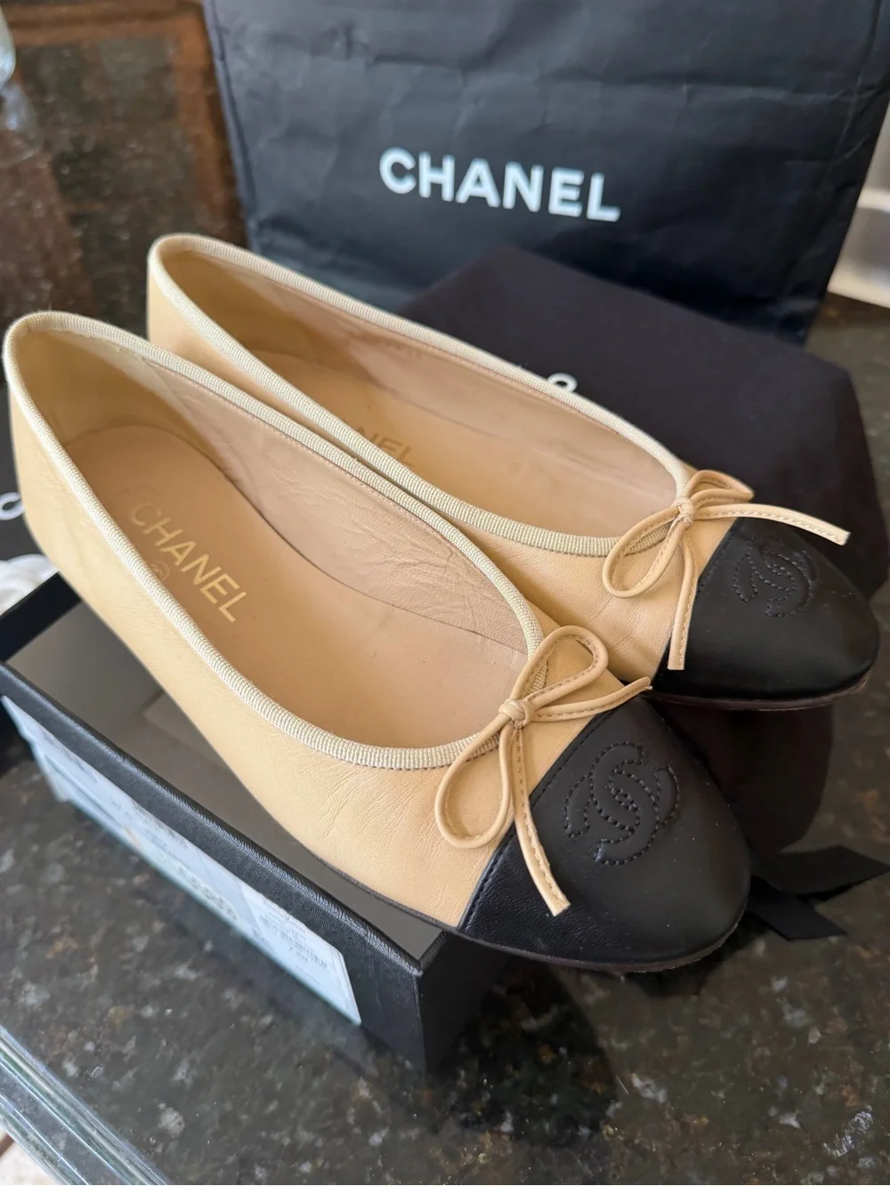 CHANEL Two-Tone Tan and Black Leather Cap-Toe Ballet Flats